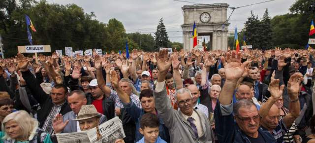 CHISINAU, MOLDOVA - SEPTEMBER 13 :  People take part in a rally demanding the resignation of President Nicolae Timofti in Chisinau, Moldova on September 13, 2015. (Photo by Ion Zaharia/Anadolu Agency/Getty Images)